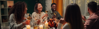 How to avoid holiday weight gain: a group of friends gathers for a healthy holiday meal.